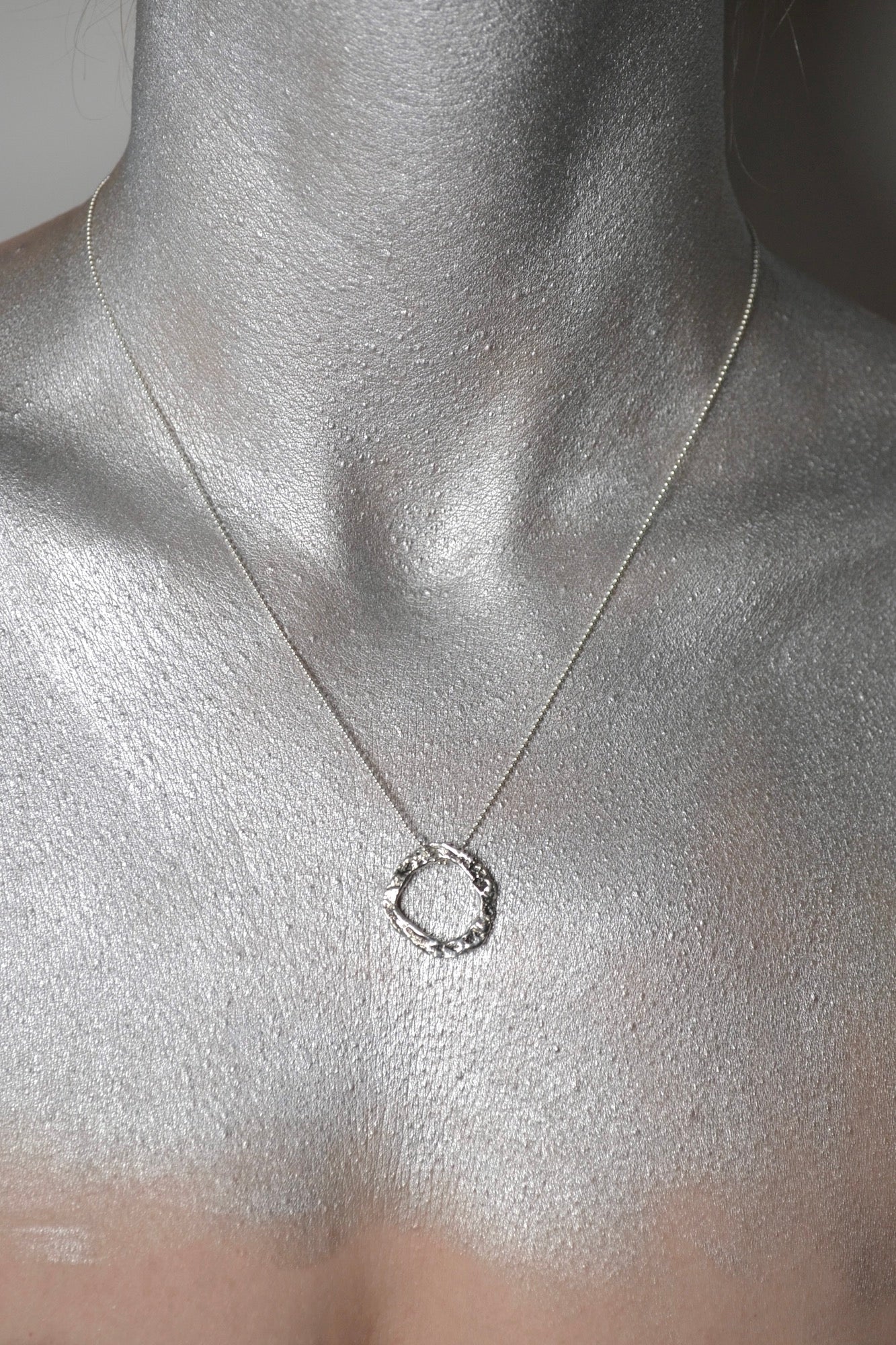 Sterling silver medium size circle frame pendant with moon texture. Comes with dainty bead silver chain