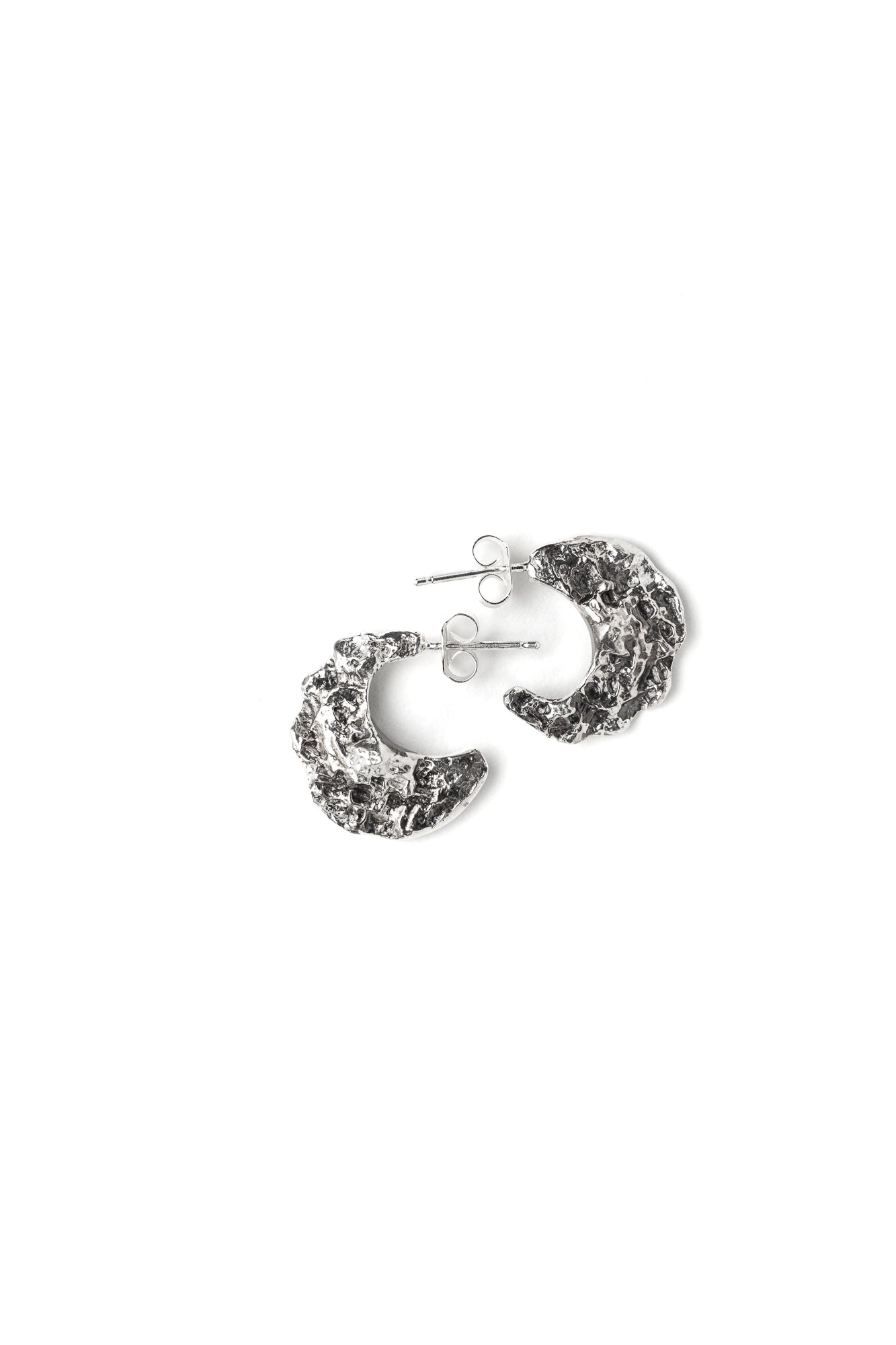 A pair of sterling silver textured hoops earrings in the shape of crescent moon with backings