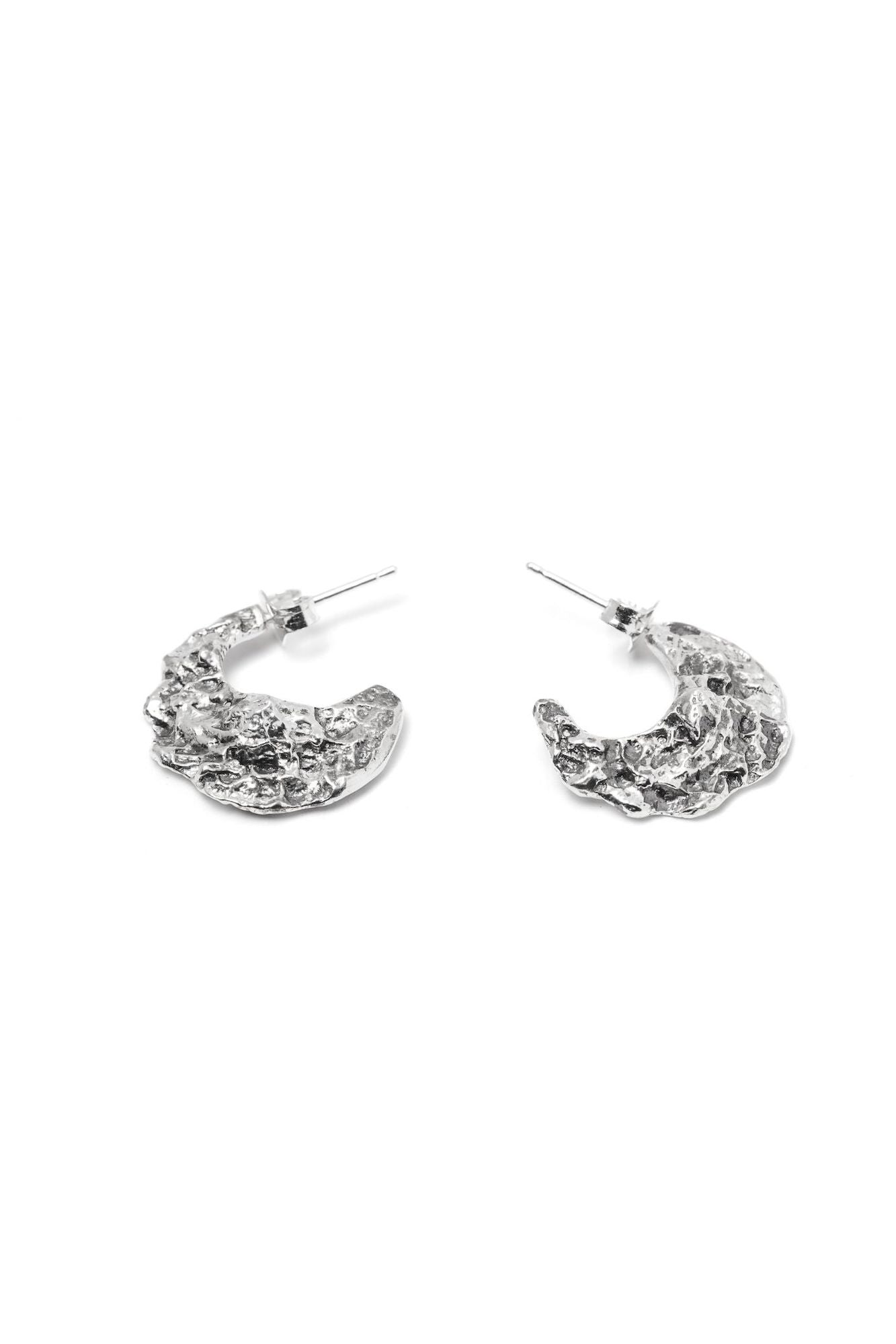 A pair of sterling silver textured hoops earrings in the shape of crescent moon with backings